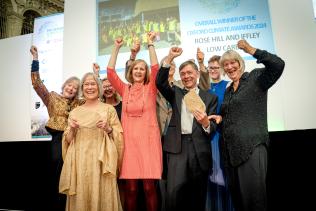 Representatives from Rose Hill Iffley Low Carbon cheering on stage