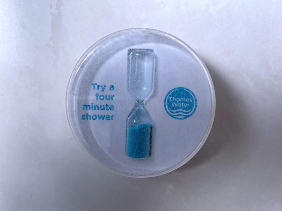 A Thames Water shower timer showing the text "Try a four minute shower".