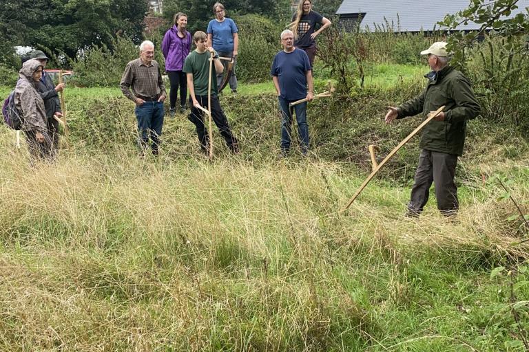 A group of people scything in Amersham