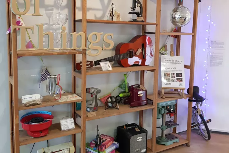 Library of things - a collection of second hand appliances and items, arranged on shelves